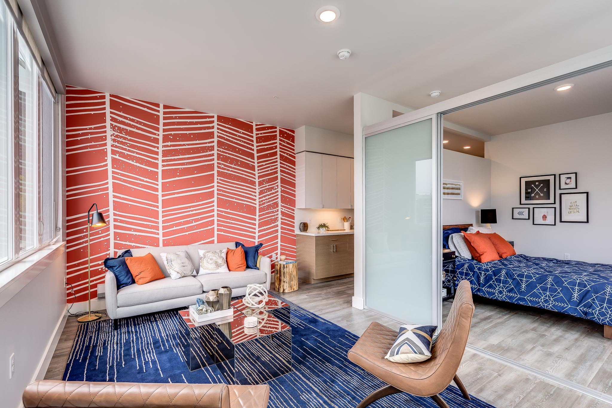 Modern Studio Apartment with blue and orange accent colors