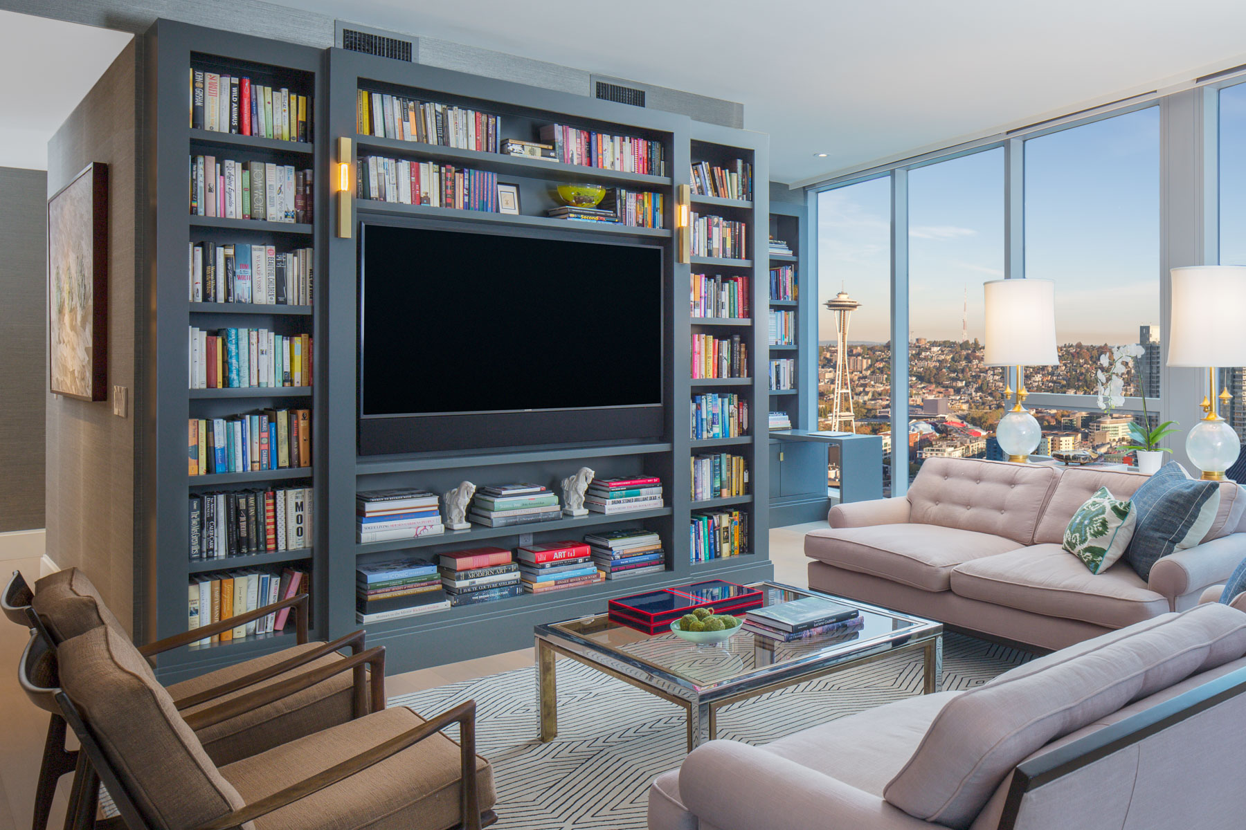 Blue bookshelf wall in luxury apartment  in Seattle