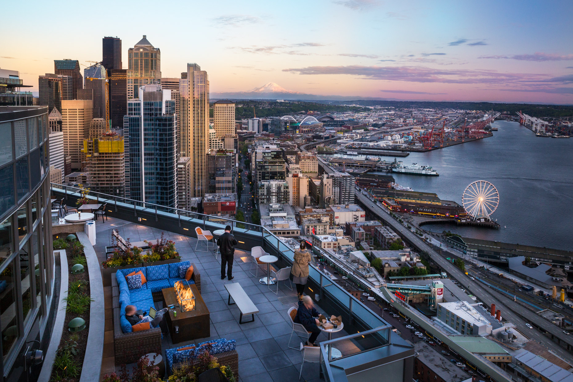Rooftop Deck in Seattle at sunset overlooking mt. rainier and puget sound